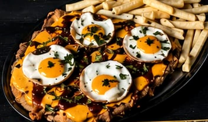 Milanesa a caballo de Laly's